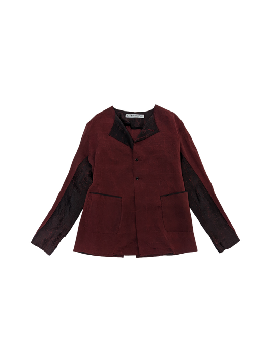 Collarless work jacket in crimson and black mud silk with silk ribbon boning.